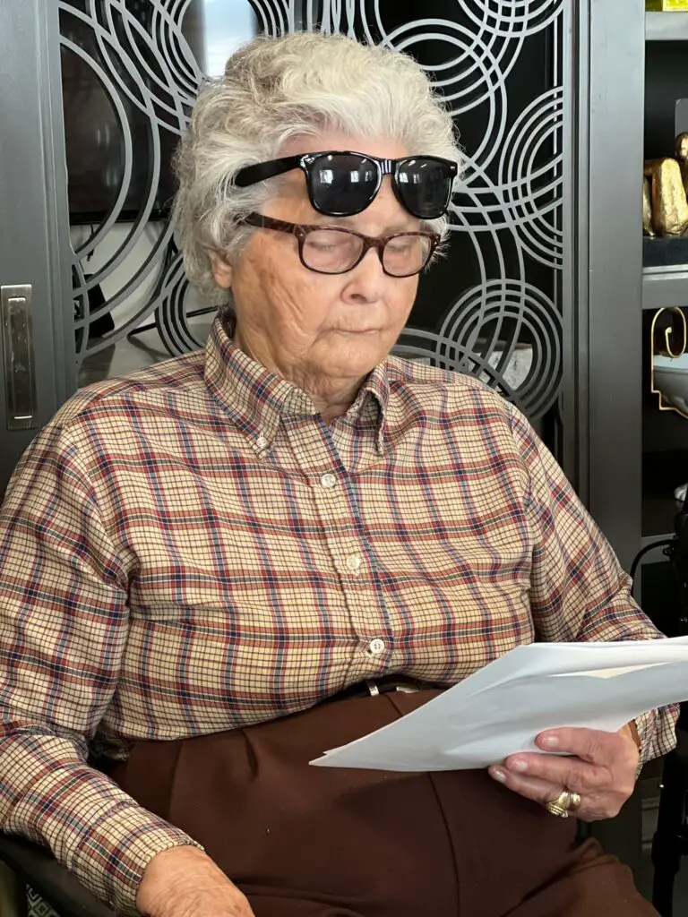 elderly woman reading a quiz