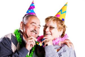 elderly people enjoying a party activity